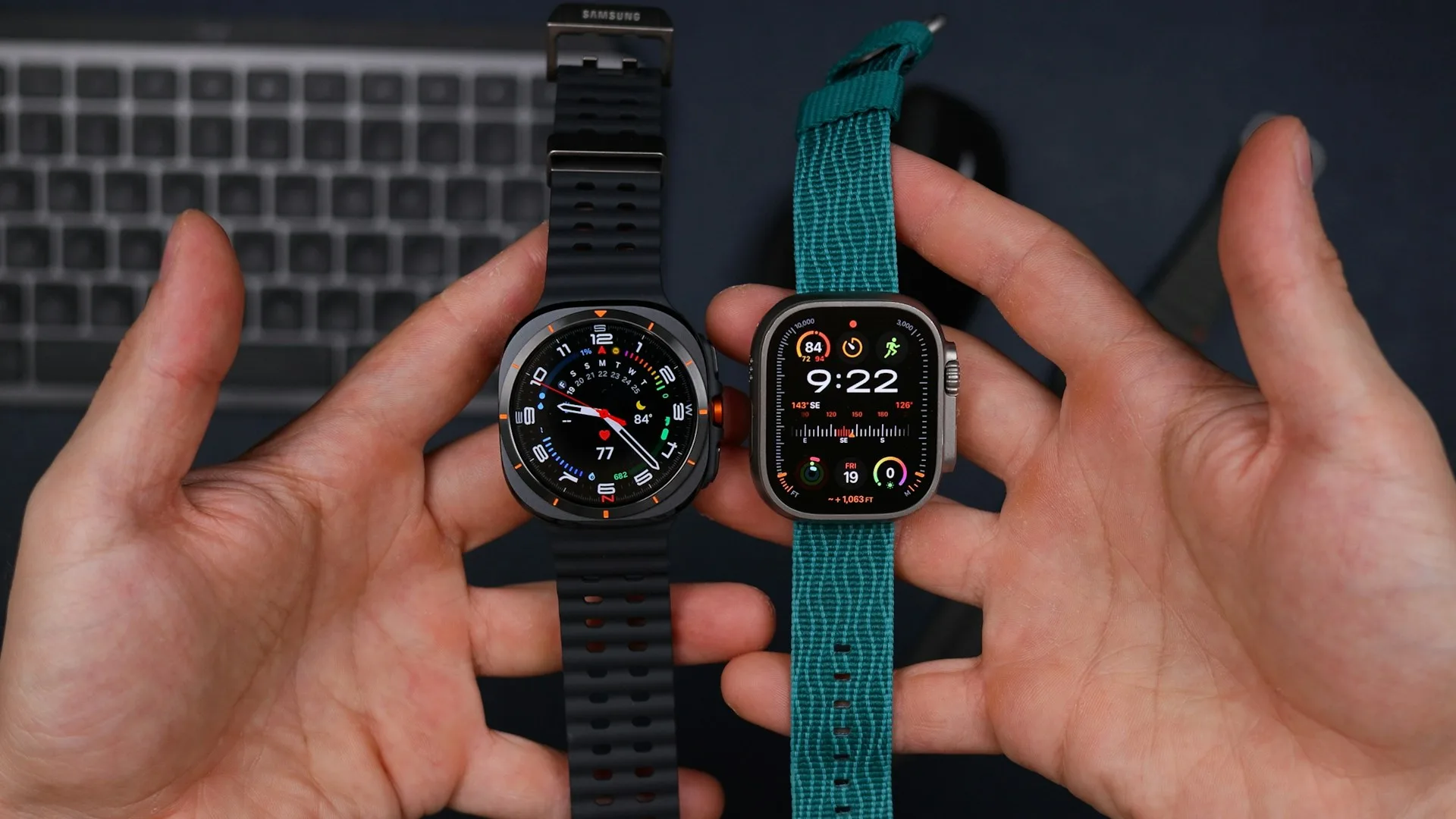 Two hands holding two different Apple Watch models side by side
