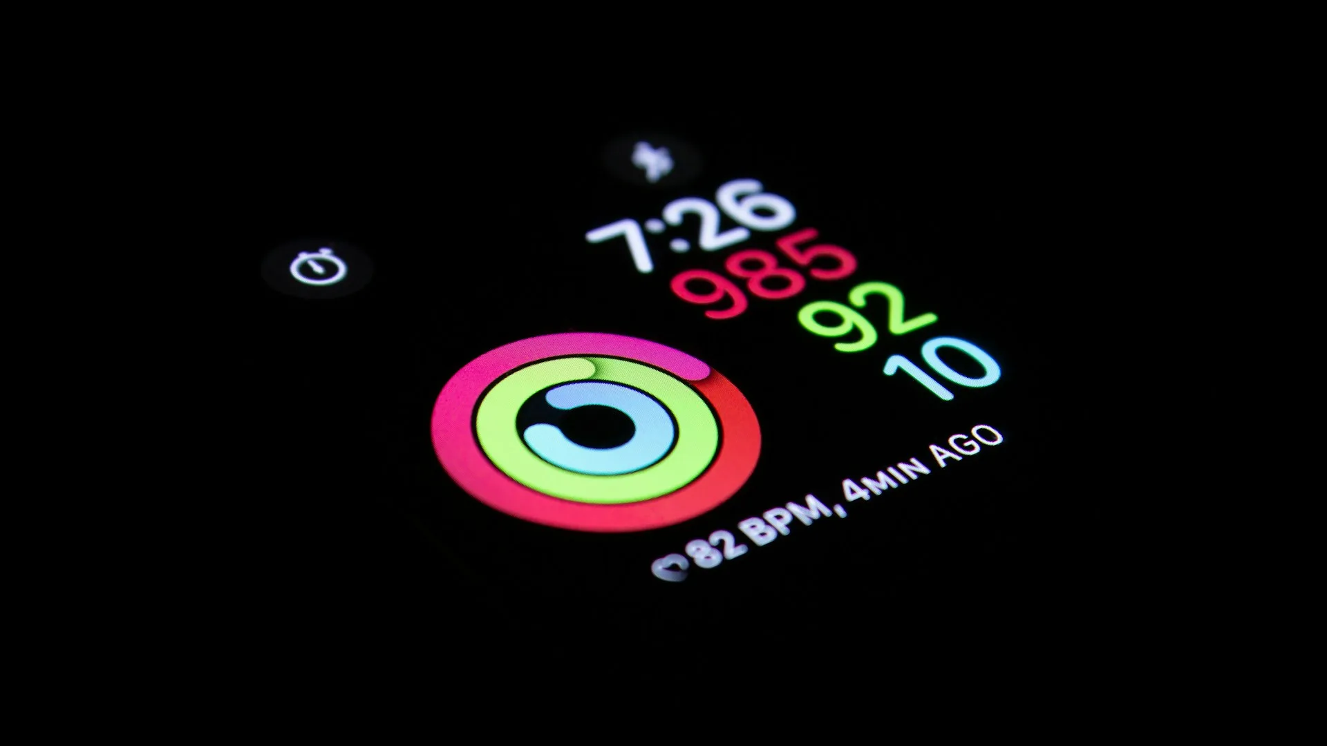 Close-up macro shot of a smartwatch face turned on